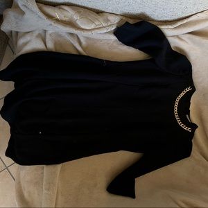 Black dress gold chain neck detail